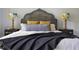 Spacious bedroom with a dark wood headboard and bedding at 120 Howard Se St, Atlanta, GA 30317