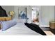 Relaxing bedroom with cozy bed and view to sitting area at 120 Howard Se St, Atlanta, GA 30317
