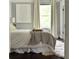 Bright bedroom with comfy bed and large window at 120 Howard Se St, Atlanta, GA 30317