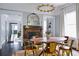 Bright dining room featuring a stylish chandelier, fireplace, and seamlessly connected living spaces at 120 Howard Se St, Atlanta, GA 30317