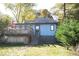 Back view of charming blue house with deck and yard at 120 Howard Se St, Atlanta, GA 30317