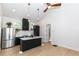 Open concept kitchen with stainless steel appliances and breakfast bar at 120 Howard Se St, Atlanta, GA 30317