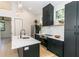Contemporary kitchen featuring a large island and dark cabinetry at 120 Howard Se St, Atlanta, GA 30317