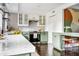 Updated kitchen featuring white and green cabinets and quartz countertops at 120 Howard Se St, Atlanta, GA 30317