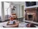 Cozy living room showcasing a dark wood fireplace, leather chair, and decorative chess set at 120 Howard Se St, Atlanta, GA 30317