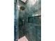 Spa-like shower with green tile and a rain shower head at 120 Howard Se St, Atlanta, GA 30317