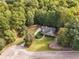 House nestled amongst lush green trees at 234 Hampton Shores Dr, Hampton, GA 30228