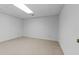Spacious finished basement room, carpeted and with ample natural light at 234 Hampton Shores Dr, Hampton, GA 30228