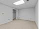 Finished basement room with closet and neutral carpeting at 234 Hampton Shores Dr, Hampton, GA 30228