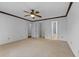 Spacious bedroom with ceiling fan and carpeted floor at 234 Hampton Shores Dr, Hampton, GA 30228