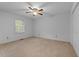 Spacious bedroom with ceiling fan and double doors to closet at 234 Hampton Shores Dr, Hampton, GA 30228