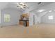 Large bonus room with kitchenette and carpeted floor at 234 Hampton Shores Dr, Hampton, GA 30228