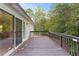 Wooden deck overlooking a wooded backyard at 234 Hampton Shores Dr, Hampton, GA 30228