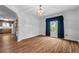 Dining room with wood-look floors and view to the kitchen at 234 Hampton Shores Dr, Hampton, GA 30228