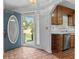 Inviting entryway with tile flooring, view of backyard, and kitchen at 234 Hampton Shores Dr, Hampton, GA 30228