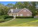 Brick house with walkway and lush green lawn at 234 Hampton Shores Dr, Hampton, GA 30228
