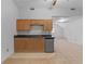 Bonus room kitchenette with oak cabinets and mini-fridge at 234 Hampton Shores Dr, Hampton, GA 30228