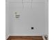 Bright laundry room with washer and dryer hookups and ample shelving at 234 Hampton Shores Dr, Hampton, GA 30228