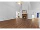 Spacious living room with a fireplace and hardwood floors at 234 Hampton Shores Dr, Hampton, GA 30228