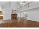 Two story living room with fireplace and hardwood floors at 234 Hampton Shores Dr, Hampton, GA 30228