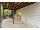 Concrete patio with access to the basement workshop at 234 Hampton Shores Dr, Hampton, GA 30228