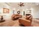 Finished basement rec room with two sofas, hardwood floors, and fireplace at 2043 Hamilton Mill Pkwy, Dacula, GA 30019