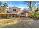 House back view, screened porch and yard at 5533 N Wind Sw Dr, Lilburn, GA 30047
