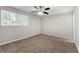 Spacious bedroom with neutral walls and carpeting at 5533 N Wind Sw Dr, Lilburn, GA 30047