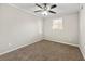 Bright bedroom with neutral walls and carpeting at 5533 N Wind Sw Dr, Lilburn, GA 30047