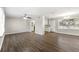 Spacious living room featuring hardwood floors and an open floor plan at 5533 N Wind Sw Dr, Lilburn, GA 30047