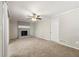 Living room with fireplace and neutral carpeting at 5533 N Wind Sw Dr, Lilburn, GA 30047