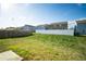 Large yard featuring a well-maintained lawn and a partial fence at 816 Royal Red Ct, Mcdonough, GA 30253