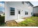 Backyard view featuring lush grass and modern light-gray siding at 816 Royal Red Ct, Mcdonough, GA 30253