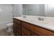 Double vanity bathroom with wood cabinets at 816 Royal Red Ct, Mcdonough, GA 30253
