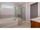 Bathroom boasts a soaking tub and walk-in shower at 816 Royal Red Ct, Mcdonough, GA 30253