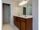 Double vanity bathroom with wood cabinets at 816 Royal Red Ct, Mcdonough, GA 30253