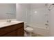 Clean bathroom with a bathtub, single sink vanity and neutral tile floor at 816 Royal Red Ct, Mcdonough, GA 30253
