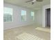 Bright bedroom with neutral walls and carpet at 816 Royal Red Ct, Mcdonough, GA 30253