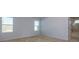 Bright bedroom with neutral walls and carpet at 816 Royal Red Ct, Mcdonough, GA 30253