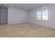 Large bonus room with neutral carpeting and a window with blinds at 816 Royal Red Ct, Mcdonough, GA 30253