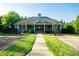 Community clubhouse featuring lush green grass and ample shade for outdoor activities at 816 Royal Red Ct, Mcdonough, GA 30253