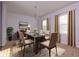 Elegant dining room featuring a glass table, chandelier, and neutral decor at 816 Royal Red Ct, Mcdonough, GA 30253