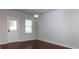 Bright dining area with hardwood floors, large window and neutral walls at 816 Royal Red Ct, Mcdonough, GA 30253