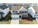 Well-maintained two-story home with attached garage, landscaped yard and brick accents, close to other homes at 816 Royal Red Ct, Mcdonough, GA 30253