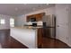 Modern kitchen with stainless steel appliances, granite countertops, and wood cabinets at 816 Royal Red Ct, Mcdonough, GA 30253