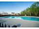 Large community swimming pool perfect for hot summer days and neighborhood relaxation, surrounded by lush landscaping at 816 Royal Red Ct, Mcdonough, GA 30253