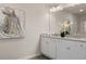 Elegant bathroom boasts double sinks, granite counters, and an art piece at 237 Epping St # 89, Stockbridge, GA 30281