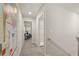Upstairs hallway with carpet, leading to bedrooms and a closet at 237 Epping St # 89, Stockbridge, GA 30281