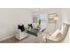 Bright home office features a desk, two chairs, and ample natural light at 237 Epping St # 89, Stockbridge, GA 30281