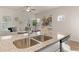 Kitchen island with granite countertop, double sink, and a view of the living area at 237 Epping St # 89, Stockbridge, GA 30281